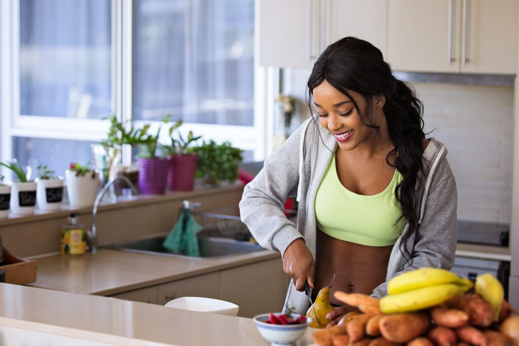 person preparing healthy foods in kitchen