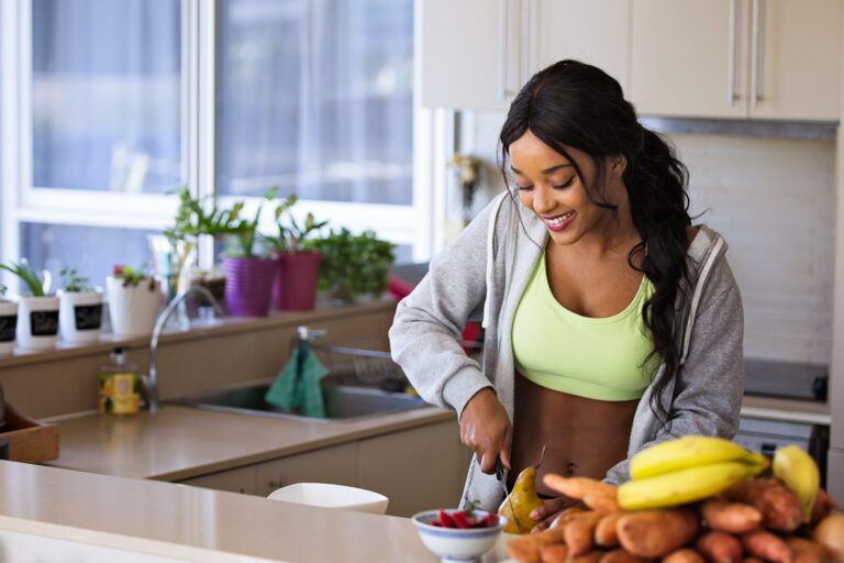 person preparing healthy foods in kitchen